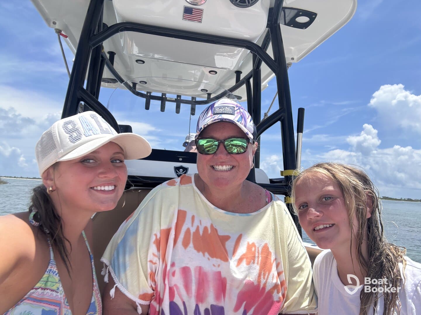 A joyful family moment captured on a boat, showcasing smiles and togetherness under a sunny sky — perfect for memorable outings on the water.