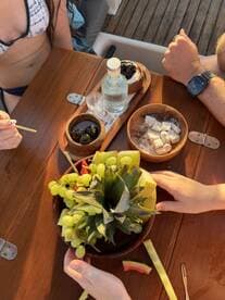 A vibrant display of fresh fruit and drinks on a boat, perfect for enjoying a refreshing snack while cruising the waters.
