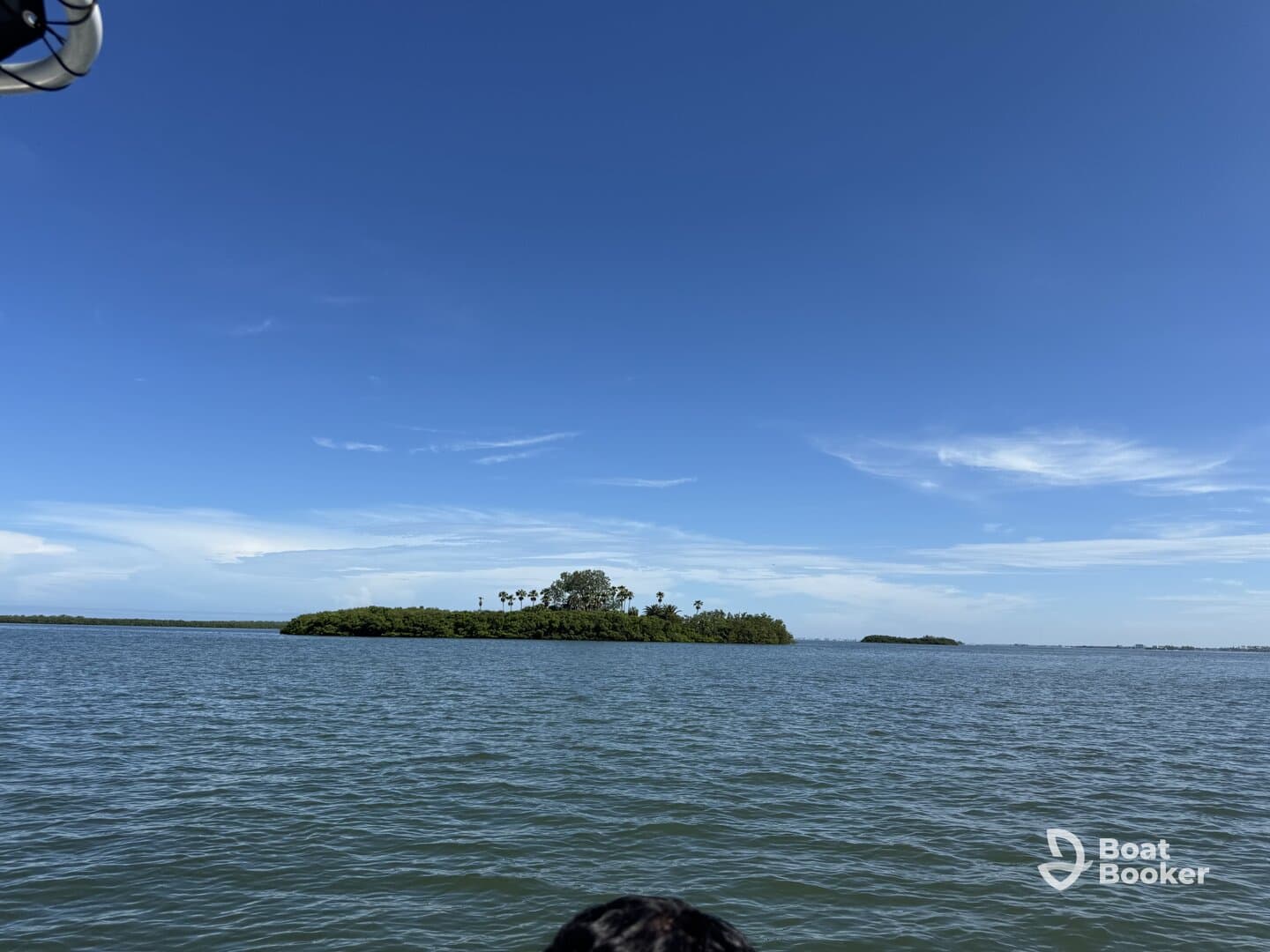 A picturesque view of a lush island surrounded by tranquil waters, perfect for exploring the natural beauty of coastal landscapes.