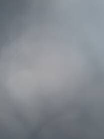 The image is unclear and blurry, making it difficult to identify any specific subject or details.
