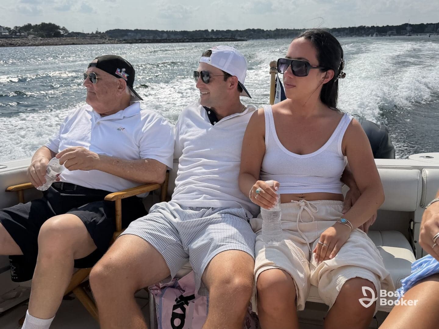 A group of friends relaxes on a boat, enjoying the sun and water — perfect for a day out on the waves.