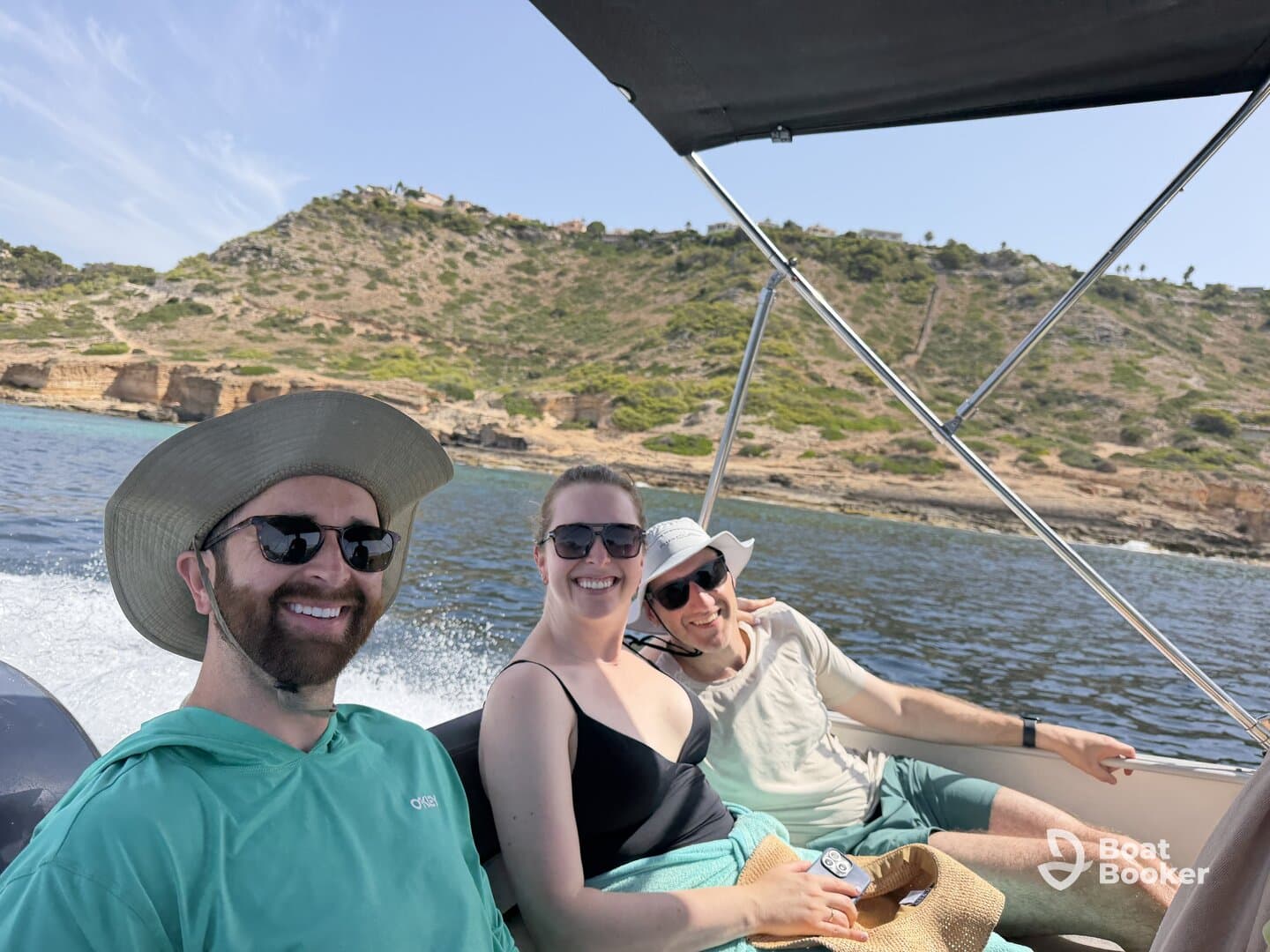 A cheerful group enjoys a sunny day on a boat, capturing the joy of outdoor adventures and camaraderie on the water.