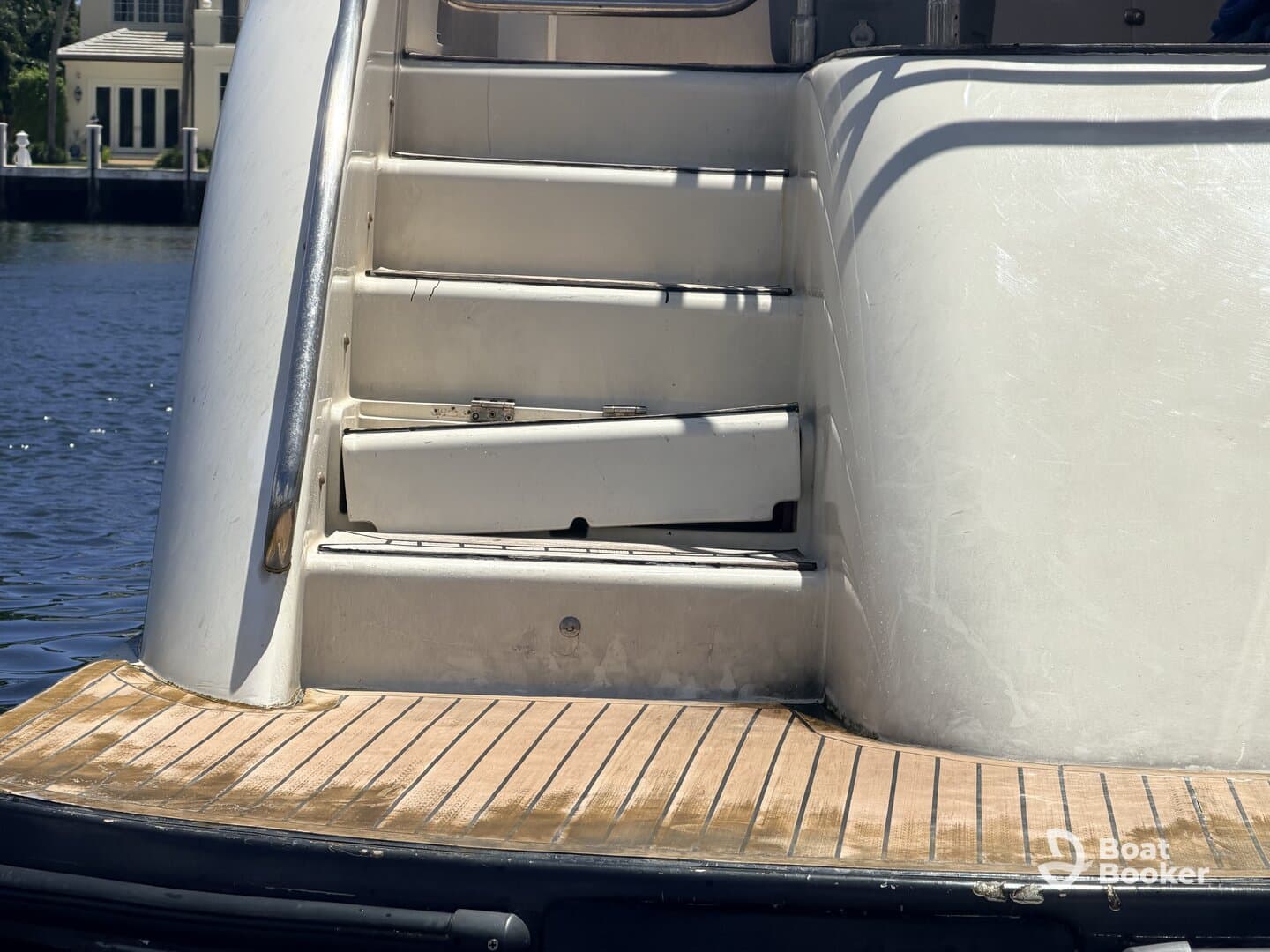 Close-up view of the interior stairs on a boat, showcasing the design and materials used in the cabin area.