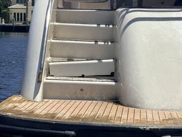 Close-up view of the interior stairs on a boat, showcasing the design and materials used in the cabin area.
