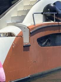 Close-up view of a boat's exterior, showcasing its unique design and structure, ideal for boat enthusiasts and charter inquiries.