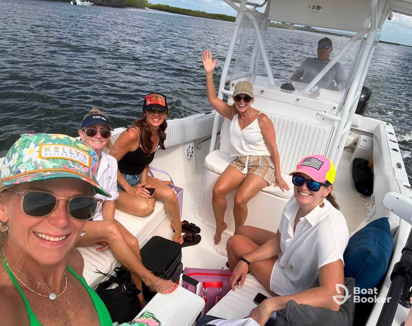 A lively group of friends enjoys a fun day on the water aboard a boat, capturing the joy of their outing with smiles and camaraderie.