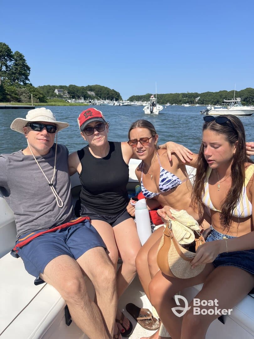 A group of friends enjoys a sunny day on the boat, capturing the essence of summer fun and camaraderie on the water.