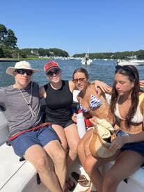 A group of friends enjoys a sunny day on the boat, capturing the essence of summer fun and camaraderie on the water.