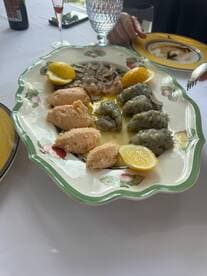 A beautifully arranged platter of seafood with lemon, perfect for onboard dining experiences or catering during a boat trip.