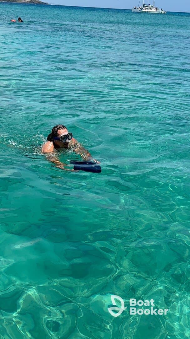 A snorkeler explores the vibrant underwater world in crystal-clear waters, showcasing the excitement of aquatic adventures.