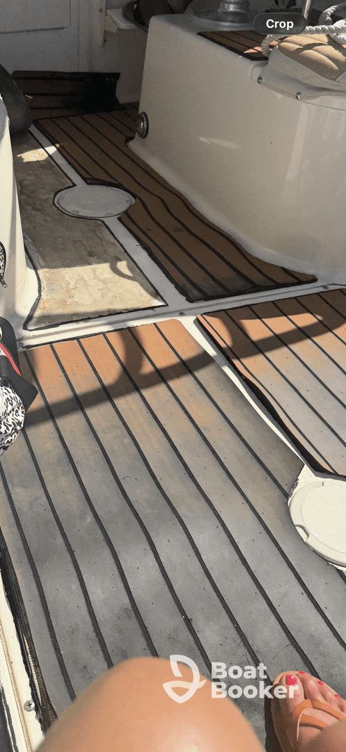 A cozy view of the interior cabin flooring on a boat, showcasing the inviting space for relaxation and comfort while on the water.