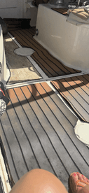 A cozy view of the interior cabin flooring on a boat, showcasing the inviting space for relaxation and comfort while on the water.