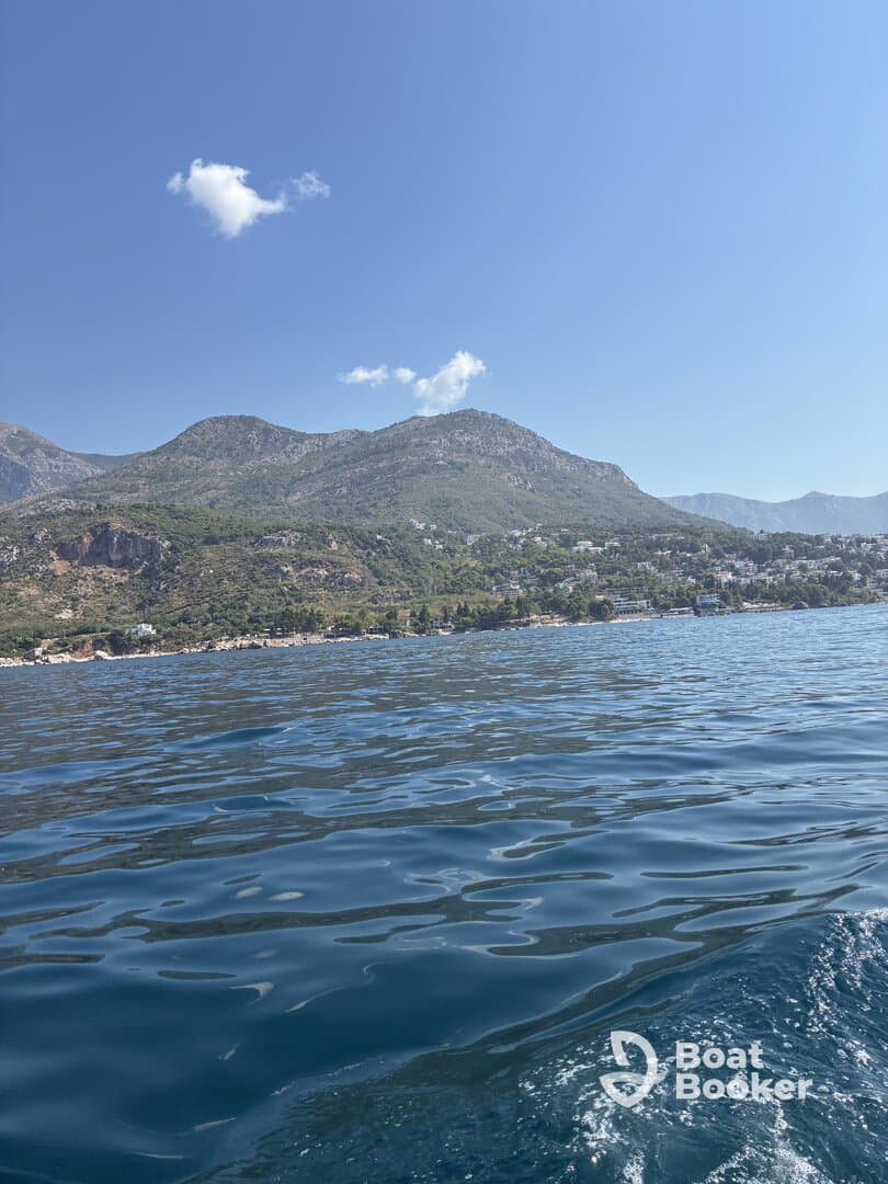 A stunning view of the coastline and mountains, showcasing the natural beauty of the area — perfect for scenic boat trips and exploration.