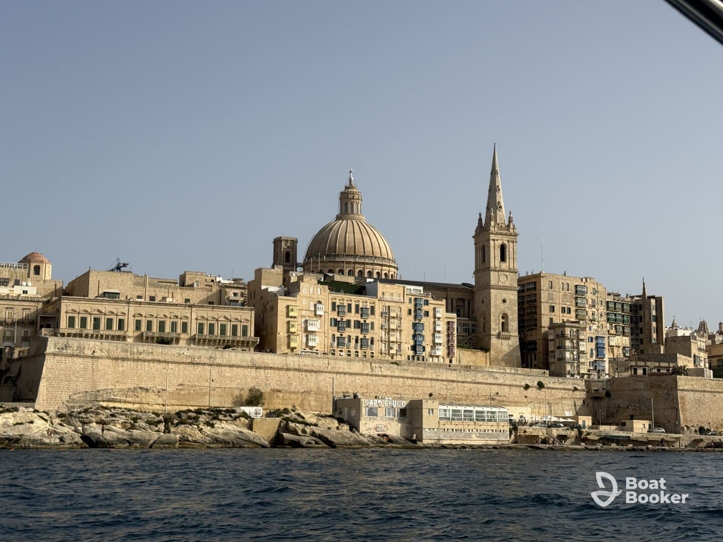 A stunning view of the historic skyline of Valletta, Malta, showcasing its iconic architecture along the coastline — perfect for sightseeing and cultural exploration.
