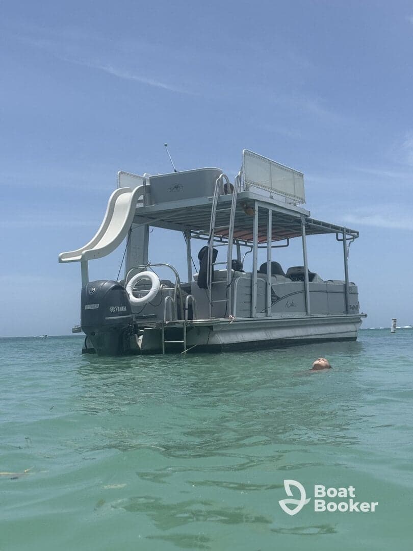 A fun-filled day on a pontoon boat with a child enjoying the water, showcasing the perfect setting for family adventures and water activities.