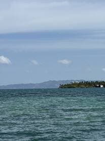 A scenic view of the water and distant land, but the image lacks clarity and detail.