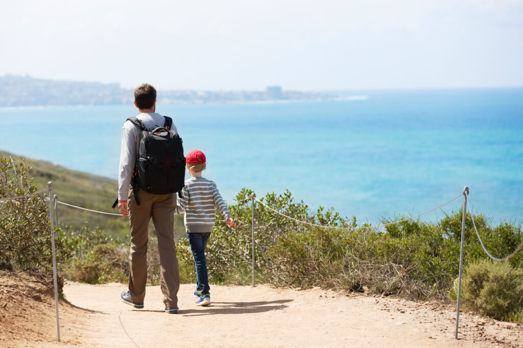 Young Active Family Of Two Hiking In Torrey Pines State